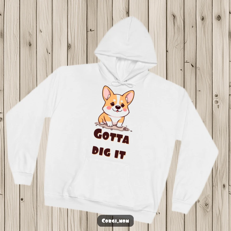 Funny Hoodie showcasing a determined Kawaii Corgi humorously digging, its focused look bringing a smile while staying warm.