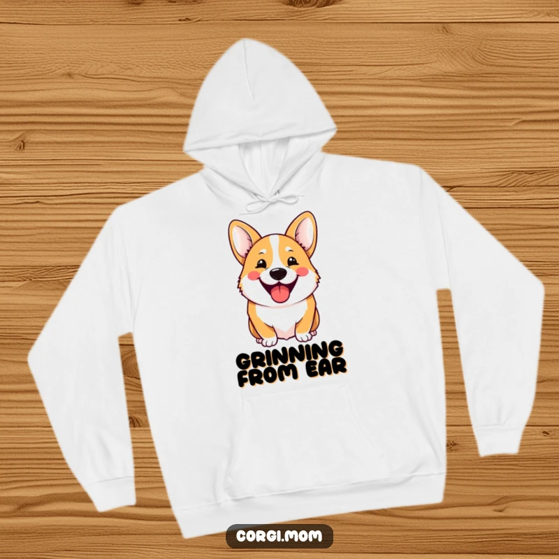 Funny Hoodie showcasing a cheerful Kawaii Corgi with a wide, hilarious grin, radiating warmth and infectious happiness.